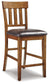 Ralene Counter Height Dining Table and 6 Barstools with Storage