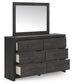 Delmorta King Panel Bed, Dresser, Mirror, Chest and Nightstand